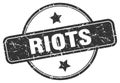 riots stamp. riots round vintage grunge label.