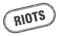 Riots stamp. rounded grunge textured sign. Label