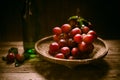 Rip of red grapes on a wooden textural