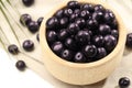 Ripe acai berries in bowl on white table, closeup Royalty Free Stock Photo