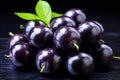 Ripe acai berry with vibrant colors on dark purple background high quality isolated image