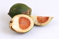 Ripe acera or betel palm nut fruit on white background with path