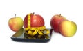 Ripe apple, kitchen scales and measuring tape isolated closeup Royalty Free Stock Photo