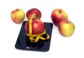Ripe apple, kitchen scales and measuring tape isolated closeup Royalty Free Stock Photo