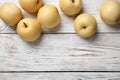 Ripe apple pears on white wooden table, flat lay. Space for text Royalty Free Stock Photo