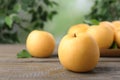 Ripe apple pears on wooden table against blurred background. Space for text Royalty Free Stock Photo