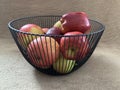 Ripe apples in a fruit bowl. Red, ripe apple in a metal vase