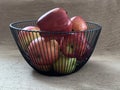 Ripe apples in a fruit bowl. Red, ripe apple in a metal vase