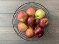 Ripe apples in a fruit bowl. Red, ripe apple in a metal vase