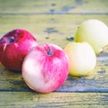 Ripe apples on old yellow garden table Royalty Free Stock Photo