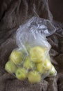 Ripe apples in a plastic bag Royalty Free Stock Photo