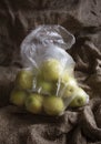 Ripe apples in a plastic bag Royalty Free Stock Photo