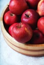 Ripe apples Starking in the wooden bowl