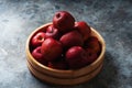 Ripe apples Starking in the wooden bowl