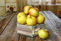 Ripe apples on a wooden table, closeup, rural style