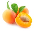 Ripe apricot fruits , one cut in half to reveal a stone, isolated on white Royalty Free Stock Photo