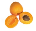 Ripe apricot fruits, one whole and divided into pieces, on a white background in isolation Royalty Free Stock Photo