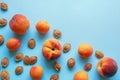 Ripe apricots and peaches and apricot stones. Copy space