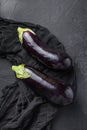 Ripe aubergine or eggplant on ablack table. Top view Royalty Free Stock Photo