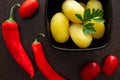 Ripe autumn apples on a background of orange leavesBoiled potatoes with chili peppers and tomatoes on a dark background Royalty Free Stock Photo