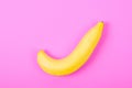 Ripe banana on pink.