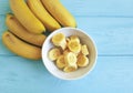 Ripe banana plate piece seasonal appetizing yummy lifestyle blue wooden background Royalty Free Stock Photo