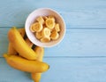 Ripe banana plate snack piece on a blue wooden background Royalty Free Stock Photo