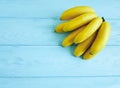 Ripe bananas vegetarian exotic seasonal cleaneating on a blue wooden background