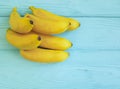 Ripe bananas on a blue wooden background