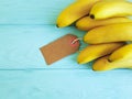 Ripe bananas on a blue wooden background freshness nature tag Royalty Free Stock Photo