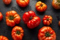 Ripe Beefsteak Tomatoes on rustic black table Royalty Free Stock Photo