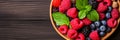 Ripe berries banner with blueberries, blackberries, raspberries in bowl. Top view, copy space Royalty Free Stock Photo