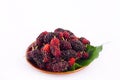 Ripe berry fruit and mulberry leaf in brown bowl on white background healthy mulberry fruit food isolated Royalty Free Stock Photo