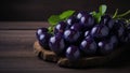 Ripe black cherries with leaves on a wooden background, Selective focus