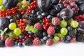 Ripe blackberries, blueberries, raspberries, red currants, plums and grapes. Mix berries and fruits. Top view. Background berries Royalty Free Stock Photo