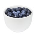 Ripe blueberries berries in a white ceramic cup on white isolated closeup Royalty Free Stock Photo
