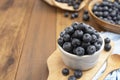 Ripe blueberries in the bowl on the wooden table. Fresh berries for breakfast. Copy space Royalty Free Stock Photo