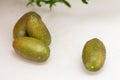 Ripe burgundy green finger-shaped citrus fruits on the dinner table, close-up. Indoor growing of the outlandish citrus plant