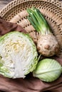 Ripe cabbage and celery on wicker plate Royalty Free Stock Photo