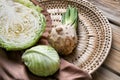 Ripe cabbage and celery on wicker plate Royalty Free Stock Photo