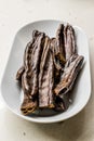 Ripe Carob Pods in Plate Ready to Eat Royalty Free Stock Photo