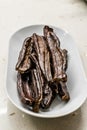 Ripe Carob Pods in Plate Ready to Eat Royalty Free Stock Photo