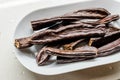 Ripe Carob Pods in Plate Ready to Eat Royalty Free Stock Photo