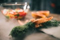 ripe carrots on wooden table with vegetables on blurred background