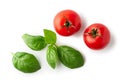 Ripe cherry tomatoes and basil leaves isolated on white background. Top view. Clipping path Royalty Free Stock Photo