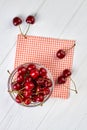 Ripe cherries in glass bowl, top view. Royalty Free Stock Photo