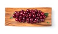 Ripe cherries and leaves in a square wooden plate on a white background Royalty Free Stock Photo