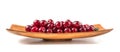 Ripe cherries and leaves in a square wooden plate Royalty Free Stock Photo