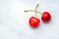 Ripe cherries white wood background