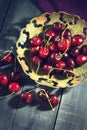 Ripe cherry in an old vase Royalty Free Stock Photo